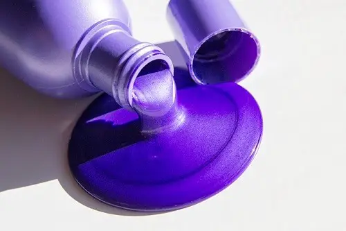 Purple Shampoo Pouring From Bottle